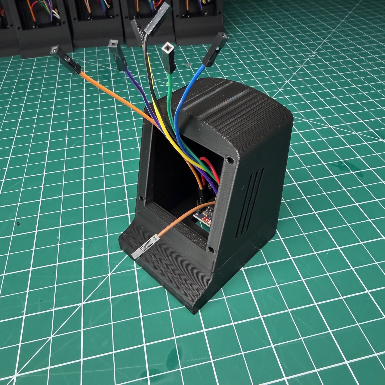 Mini Airplane Radar housing during assembly, with electronics and wiring exposed on the workbench